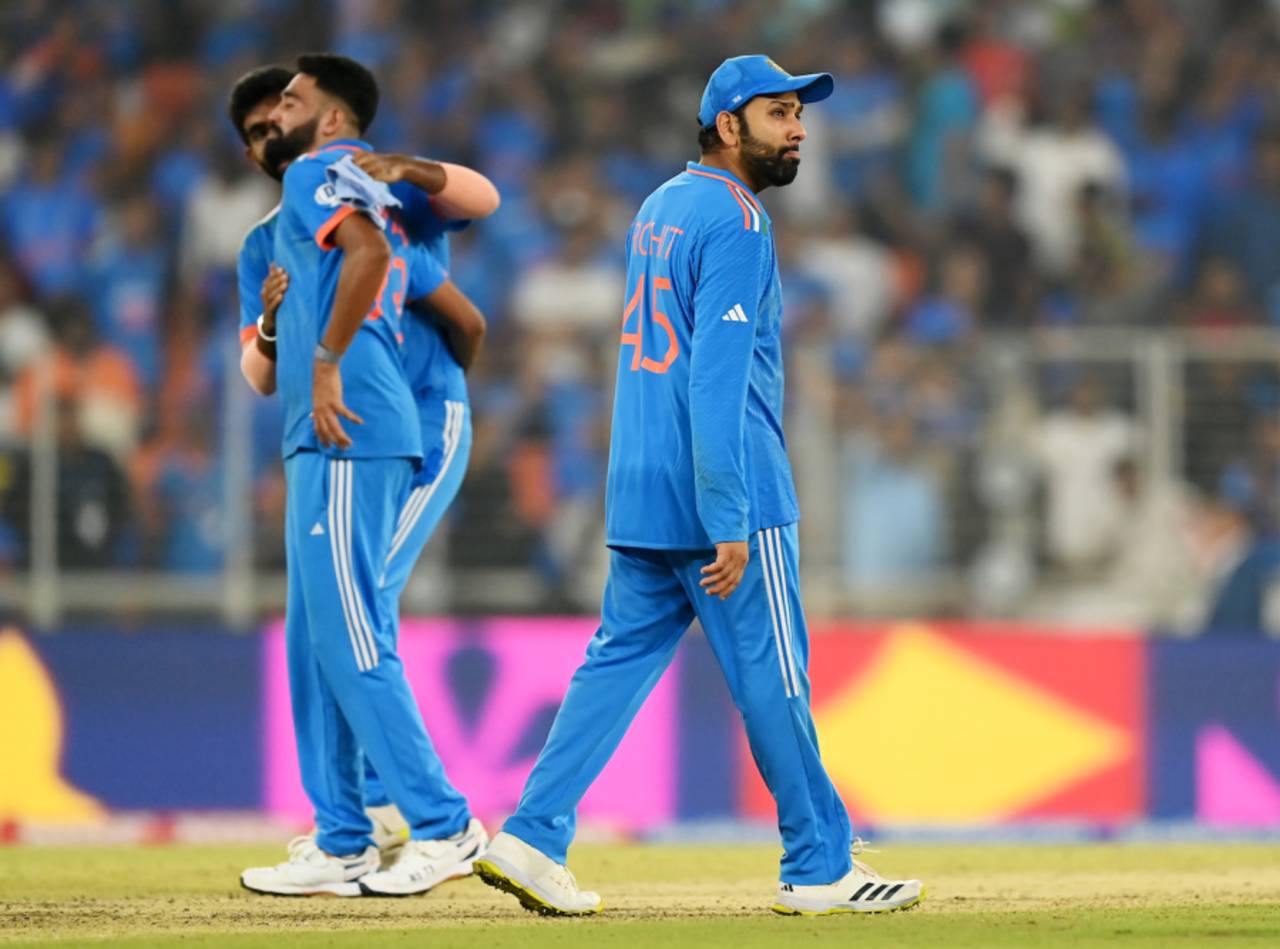 Rohit Sharma walks past, dejected, as Jasprit Bumrah consoles Mohammed Siraj, India vs Australia, Men's ODI World Cup final, Ahmedabad, November 19, 2023