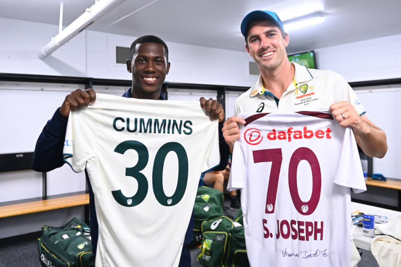 Pat Cummins and Shamar Joseph pose with their exchanged jerseys&nbsp;&nbsp;&bull;&nbsp;&nbsp;Cricket Australia/Getty Images