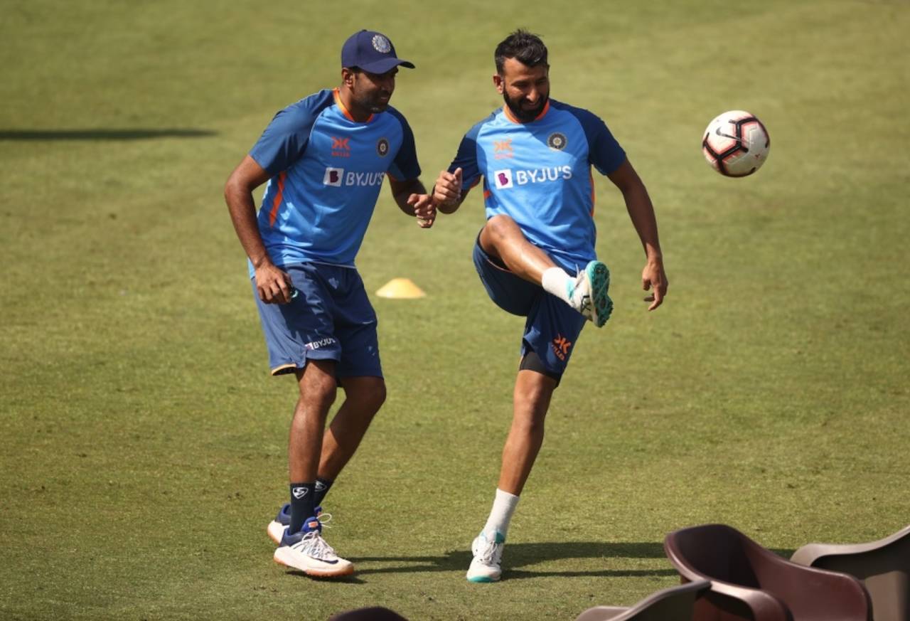 Ashwin and Pujara have a kick-about in Pujara's last Test series, against Australia at home in 2023&nbsp;&nbsp;&bull;&nbsp;&nbsp;Robert Cianflone/Getty Images