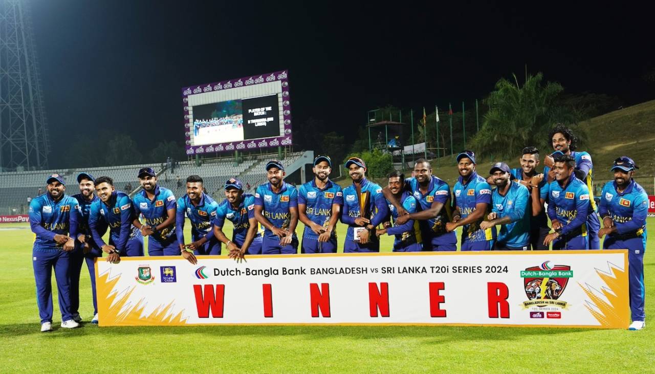 The Sri Lanka players point to their wrists - a reference to the controversial Angelo Mathews timed-out dismissal - after winning the series, Bangladesh vs Sri Lanka, 3rd T20I, Sylhet, March 9, 2024