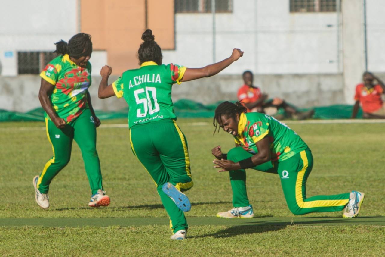 The Vanuatu Women players celebrate a wicket