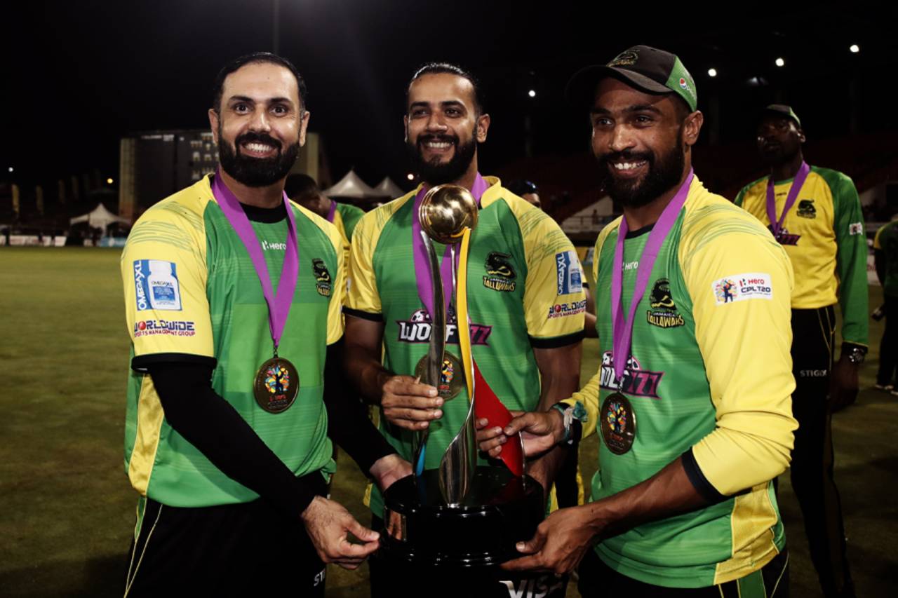 Mohammad Nabi, Imad Wasim and Mohammad Amir pose with the CPL trophy, Barbados Royals vs Jamaica Tallawahs, CPL 2022 final, Providence, September 30, 2022