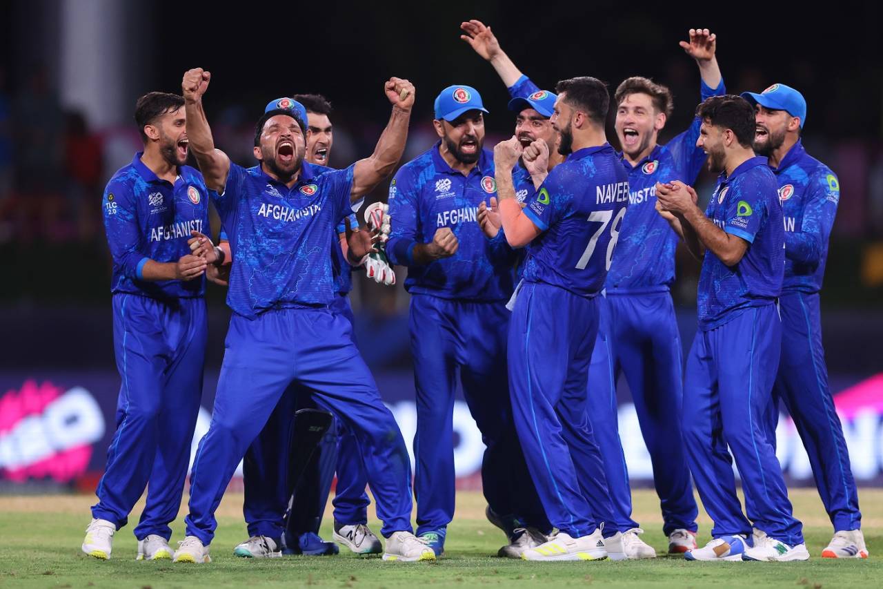 Gulbadin Naib and his team-mates celebrate a review going their way, Afghanistan vs Australia, T20 World Cup, Super Eight, Group 1, Kingstown, June 22, 2024