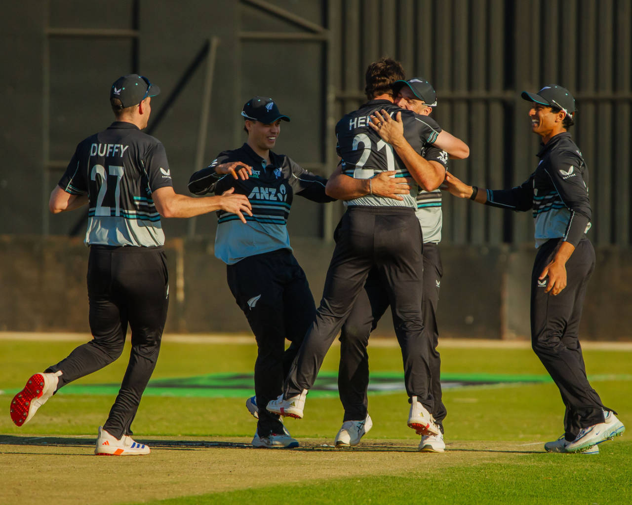 Matt Henry is mobbed by his mates after defending seven runs in the final over, New Zealand vs South Africa, Harare, Zimbabwe T20I tri-series, July 26, 2025