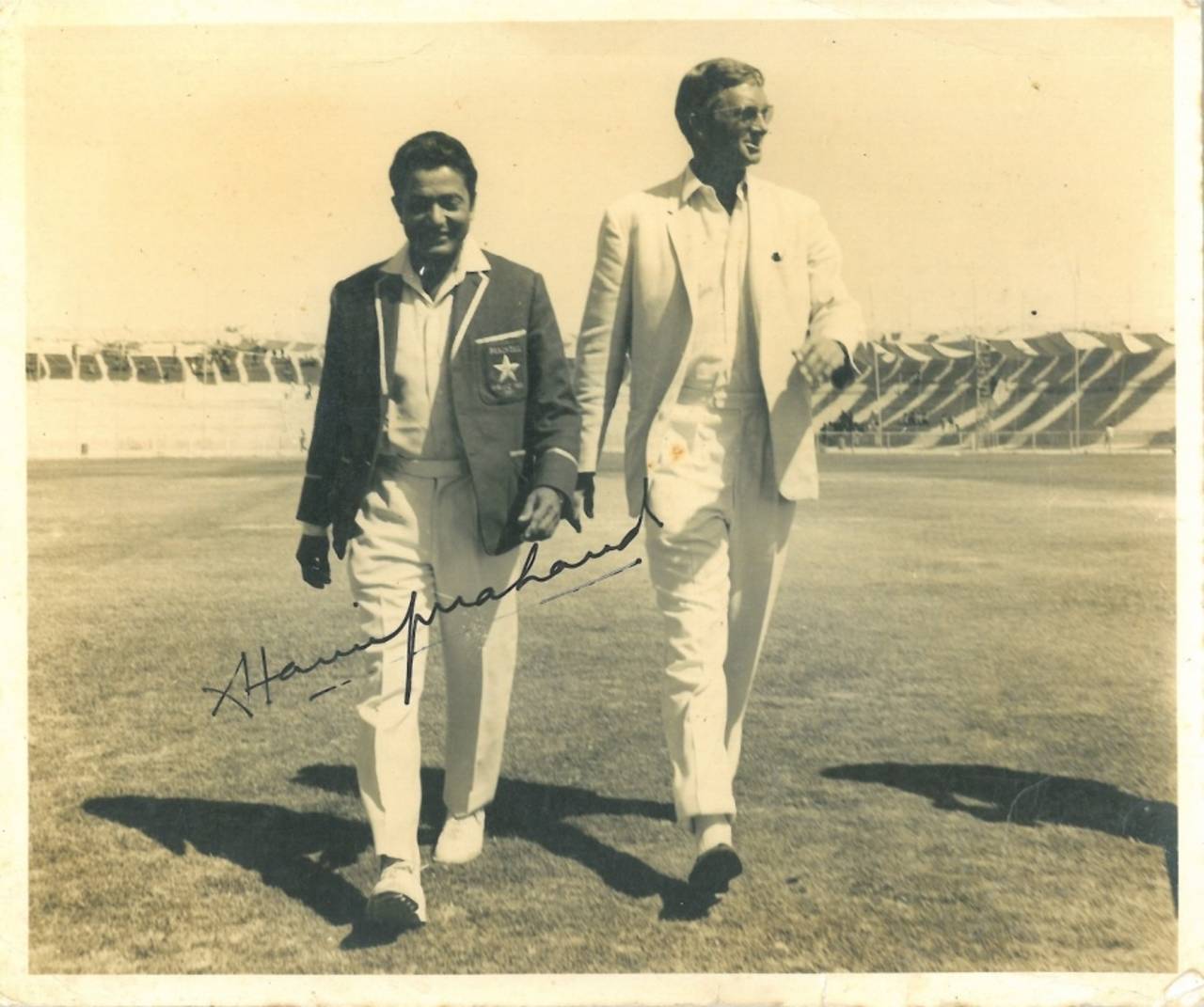 Hanif Mohammad and Richie Benaud walk out for the toss in a game on the Commonwealth XI's 1967-68 tour of Pakistan, March 1968