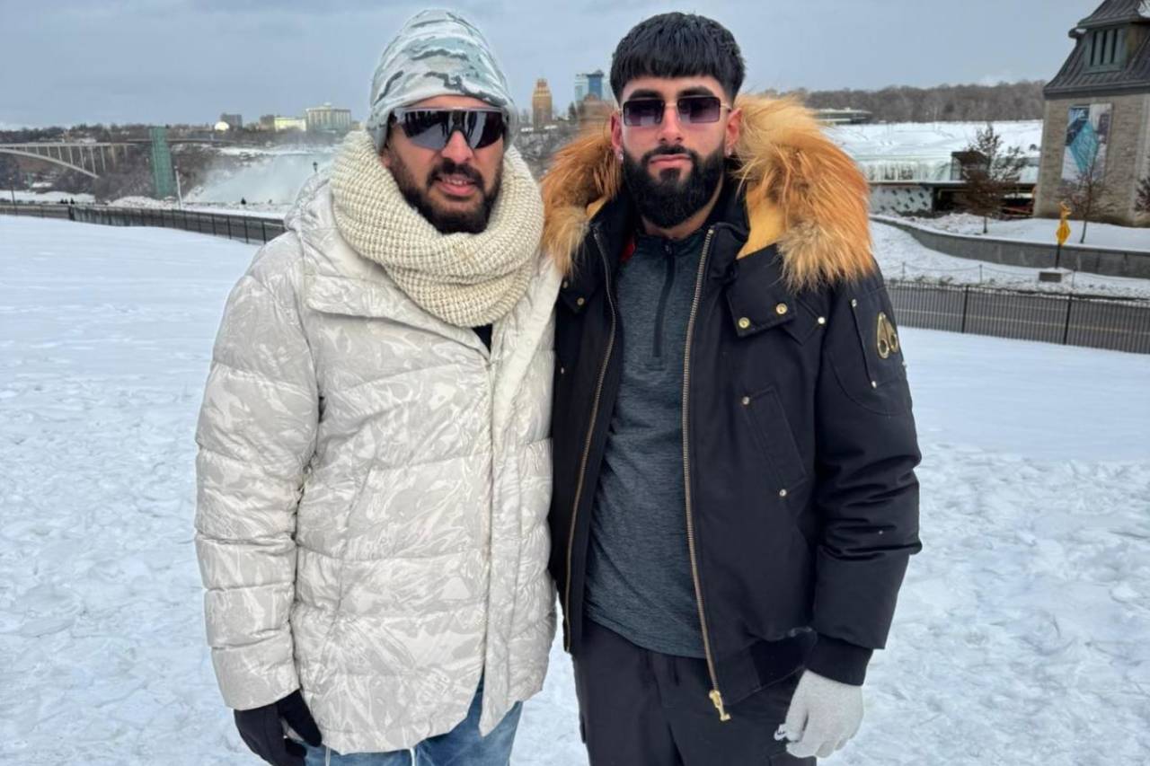 Yuvraj Samra and his father Baljit pose in the snow