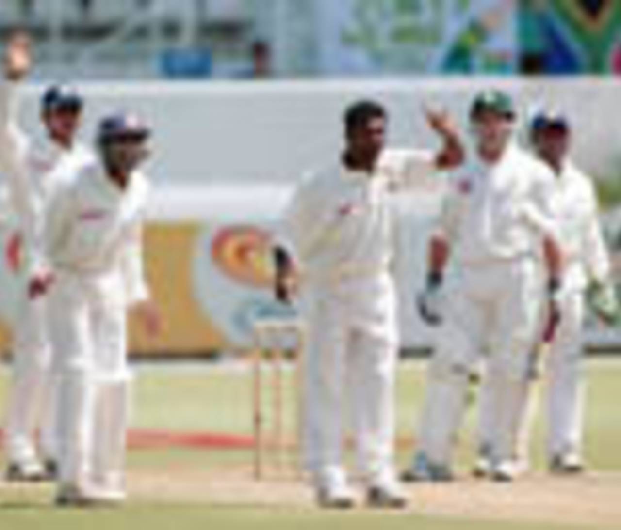 Sri Lankan off spinner Muttiah Muralitharan appeals with his team mates for a leg before wicket as South African batsman Mark Boucher watches at Durban's Kingsmead cricket stadium on 27 December 2000 during the second day of the first test match.