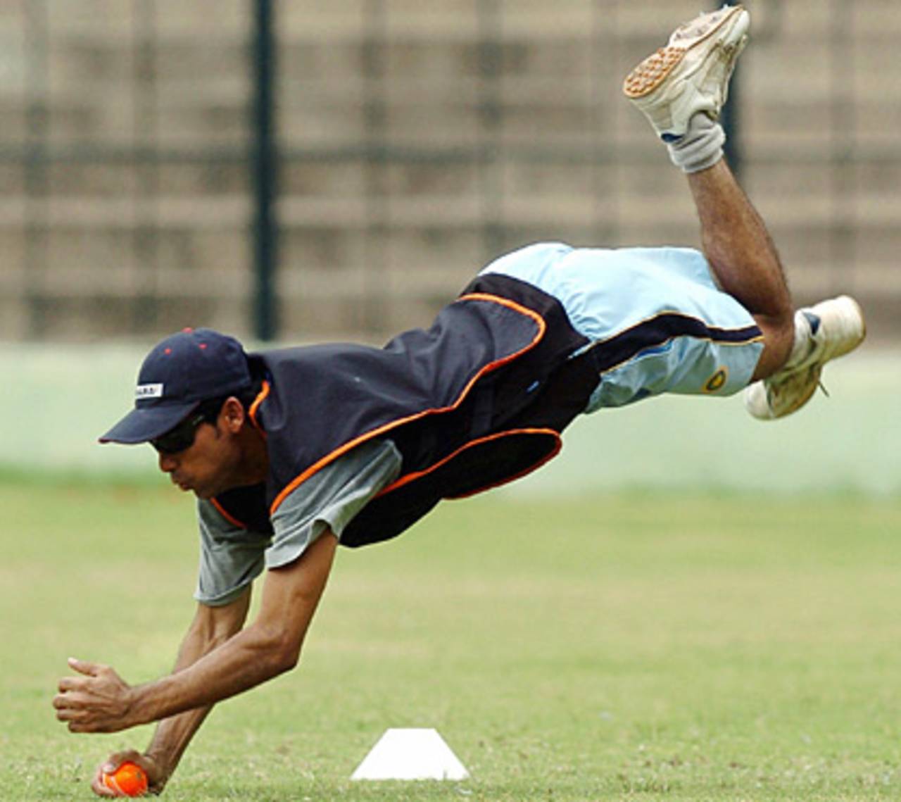 Mohammad Kaif dives to catch a ball in a training session, July 8, 2005