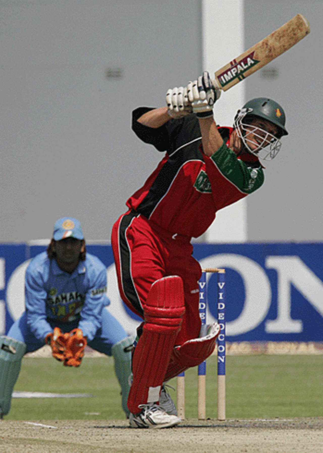 Andy Blignaut heaves one through mid off during his 26-ball cameo of 41, Zimbabwe v India, Harare, September 4, 2005
