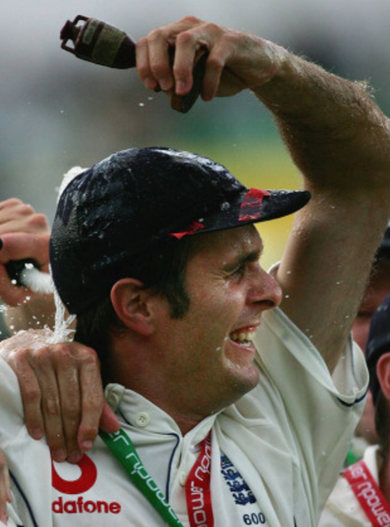 Drenched in champagne, Michael Vaughan holds the urn aloft&nbsp;&nbsp;&bull;&nbsp;&nbsp;Getty Images