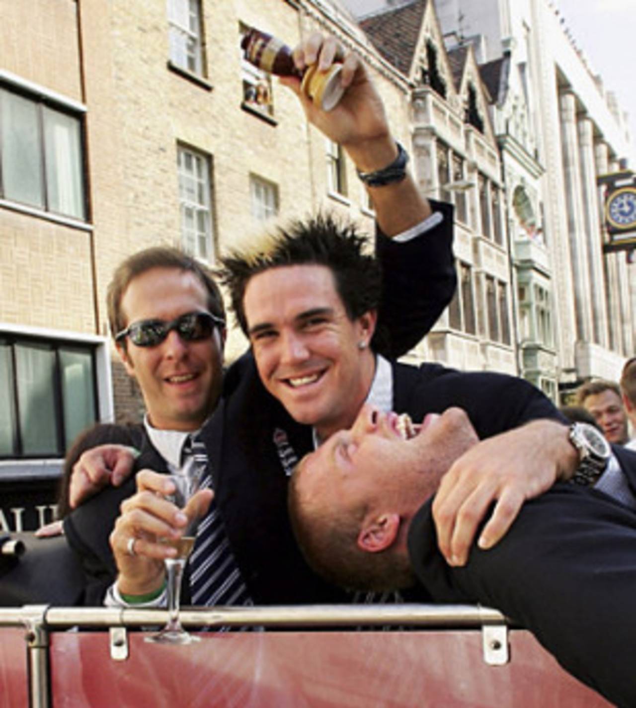 Michael Vaughan holds the urn while Kevin Pietersen and Andrew Flintoff lark about, London,  September 13, 2005