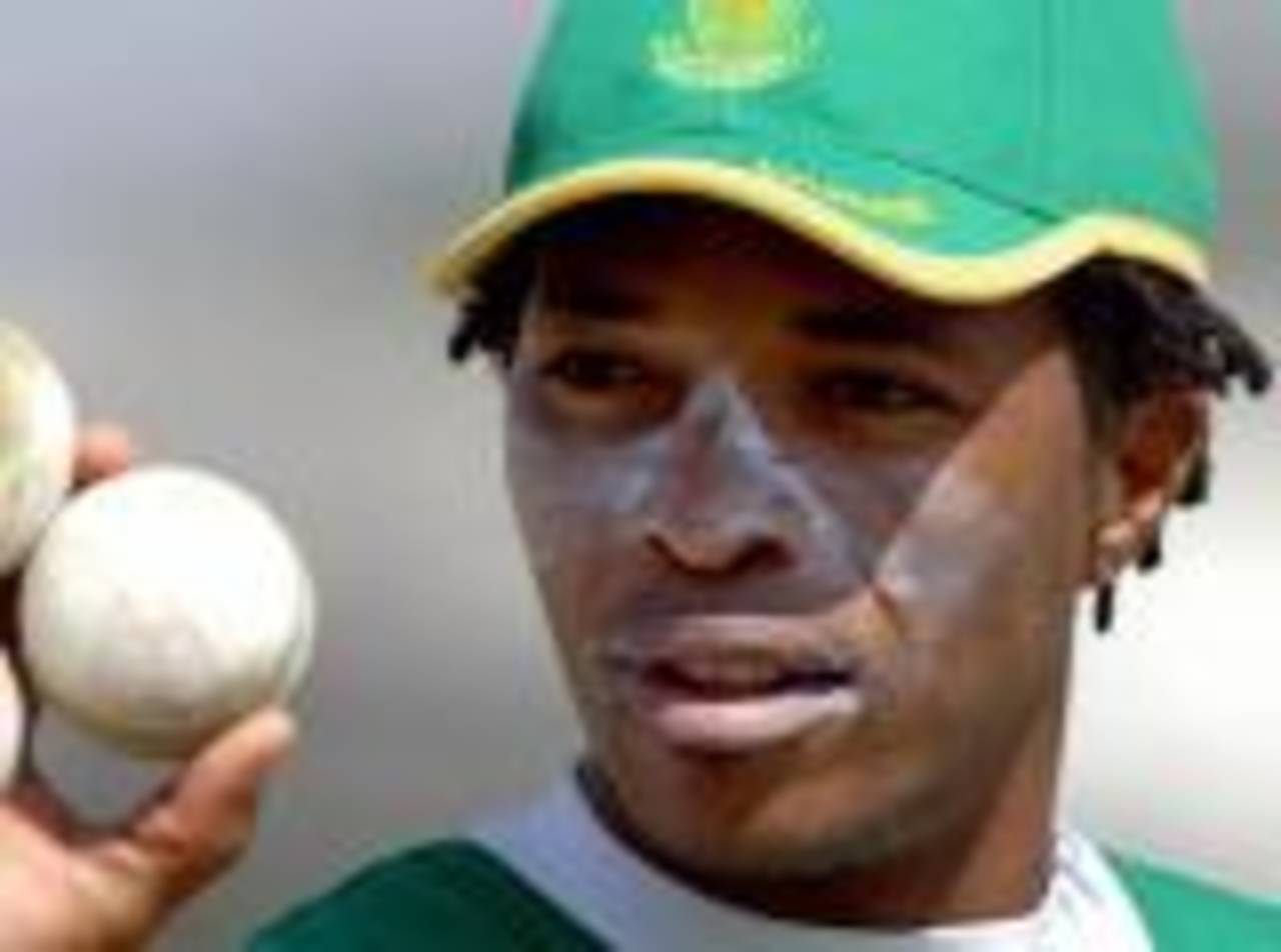 Makhaya Ntini inspects his weapon of choiceduring a practice match in Hyderabad, Hyderabad, November 14, 2005