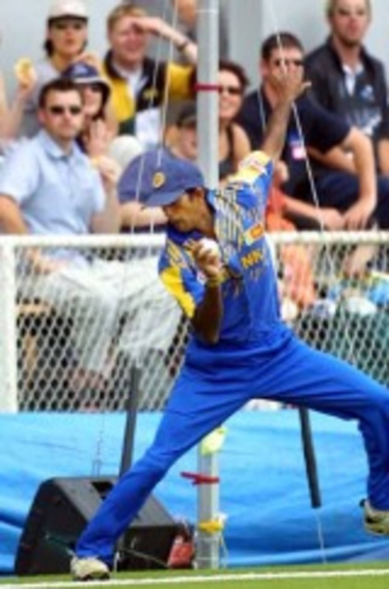 Sri Lankan fielder Kumar Dharmasena catches a ball struck over midwicket by New Zealand batsman Jacob Oram on 10, but carries it back over the boundary rope to concede six runs. Oram went on to score 59. 5th One-Day International: New Zealand v Sri Lanka at Jade Stadium, Christchurch, 11 February 2001.