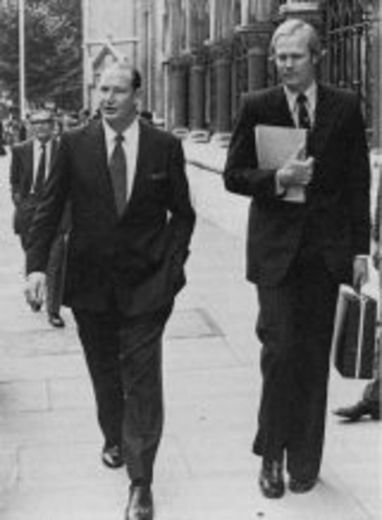 Kerry Packer and Tony Greig outside the High Court in London, October 1977