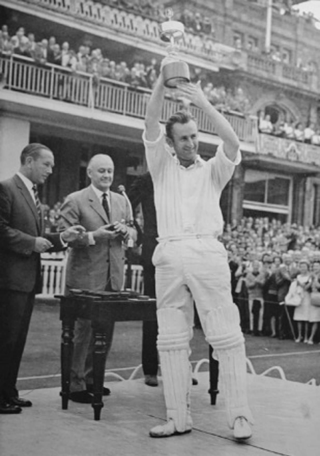 Ted Dexter lifts the Gillette Cup after Sussex's victory in 1964