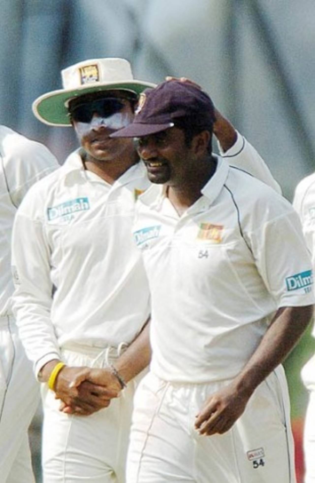 Muttiah Muralitharan is congratulated by his proud captain Mahela Jayawardene,  Sri Lanka v Pakistan, 2nd Test, Kandy, 2nd day, April 4 2006
