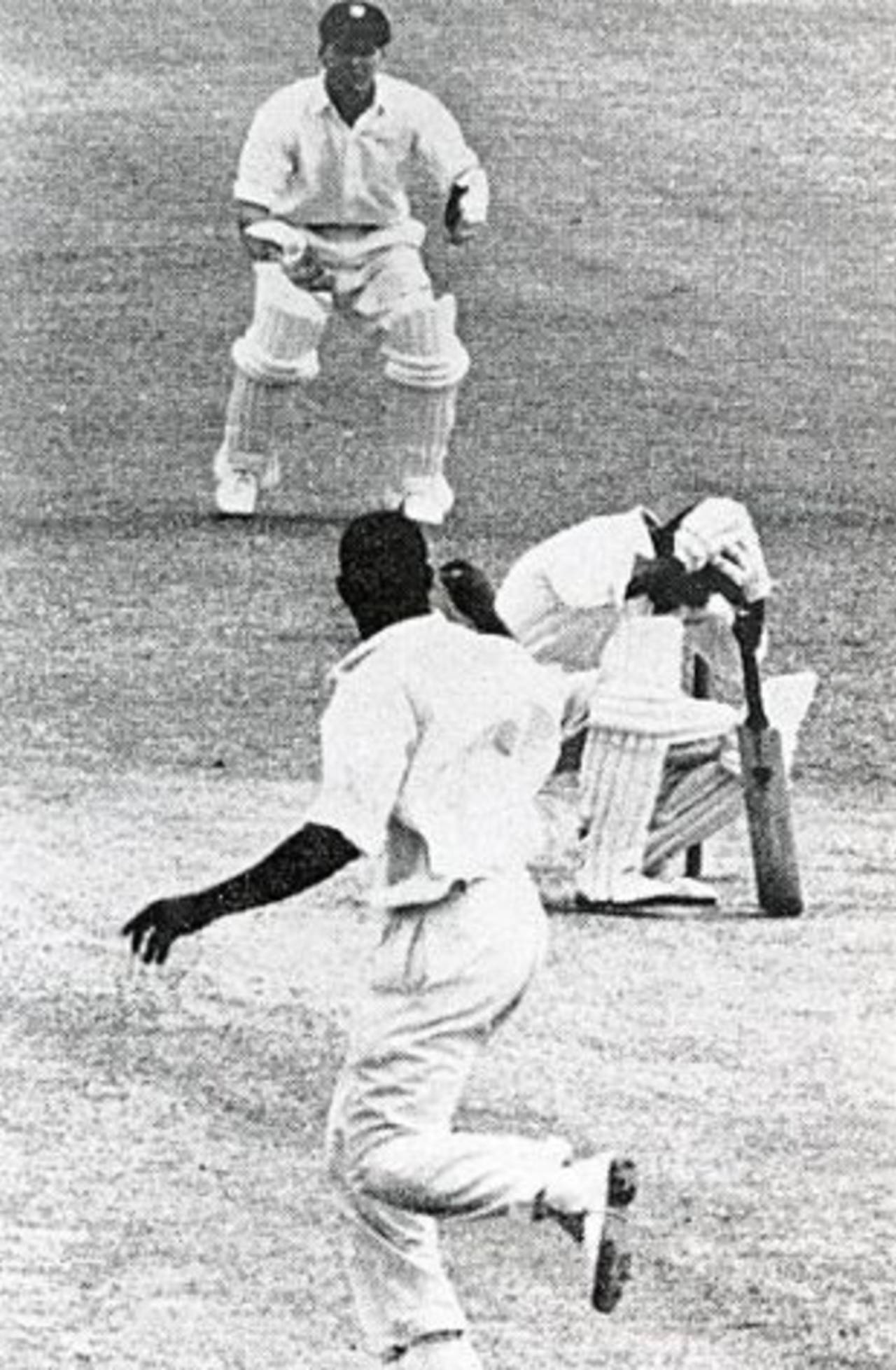 Nari Contractor clutches his head after being struck by Charlie Griffith, Barbados v Indians, March 17, 1962