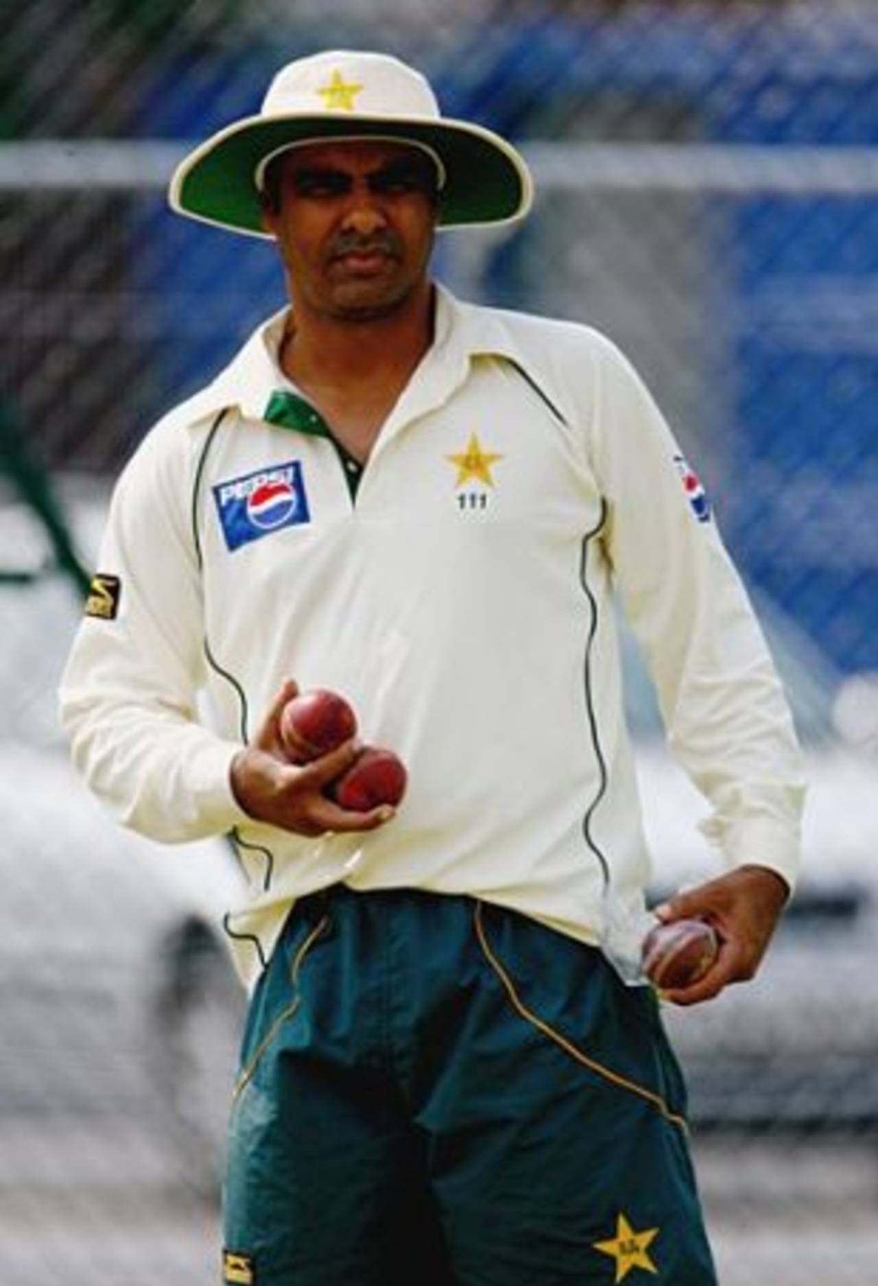 Waqar's three-ball-trick: Waqar Younis watches a net session ahead of the second Test against England, Old Trafford, July 26, 2006