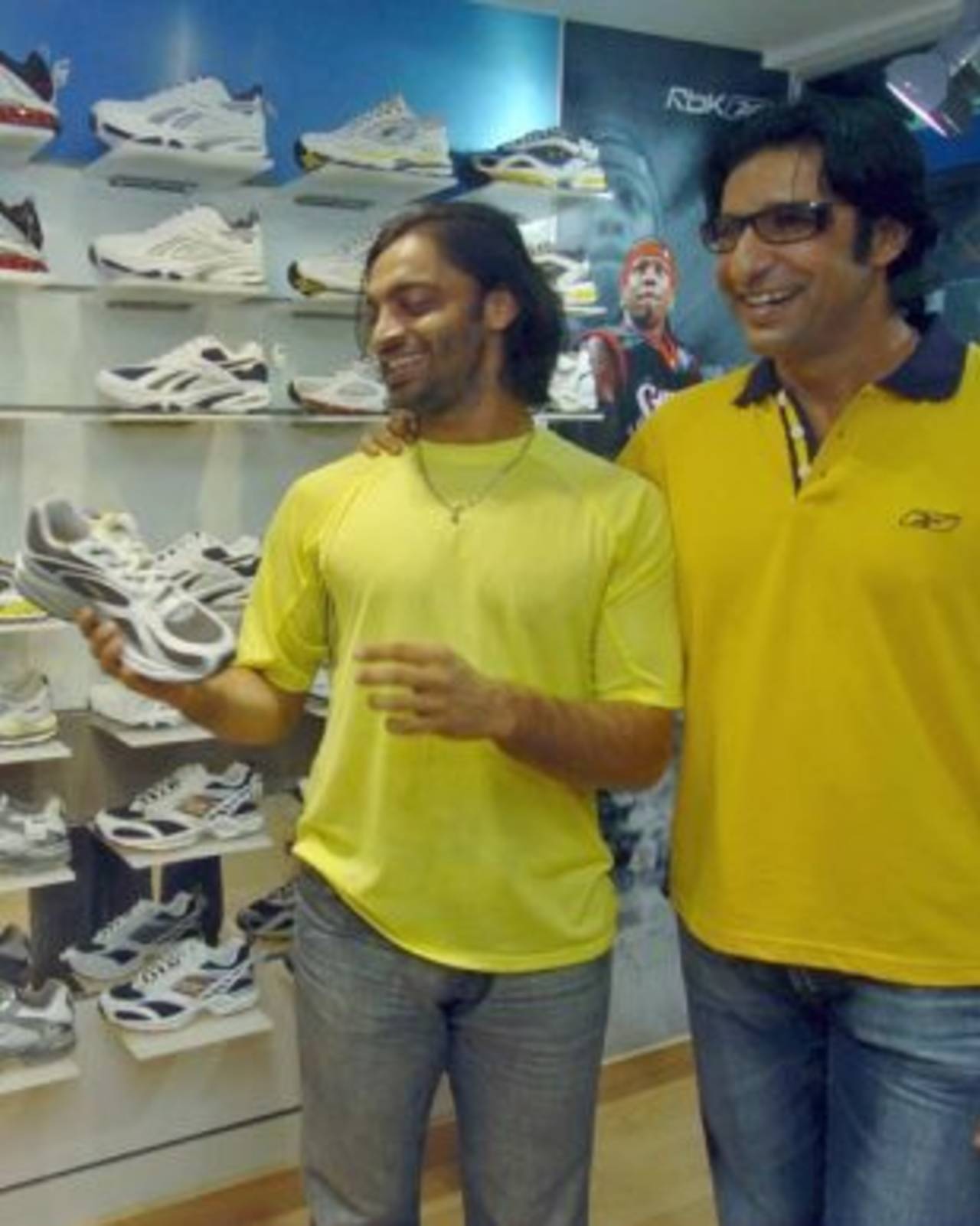 Shoaib Akhtar and Wasim Akram strike a pose at the opening of Akram's new shoe shop, Karachi, September 27, 2006