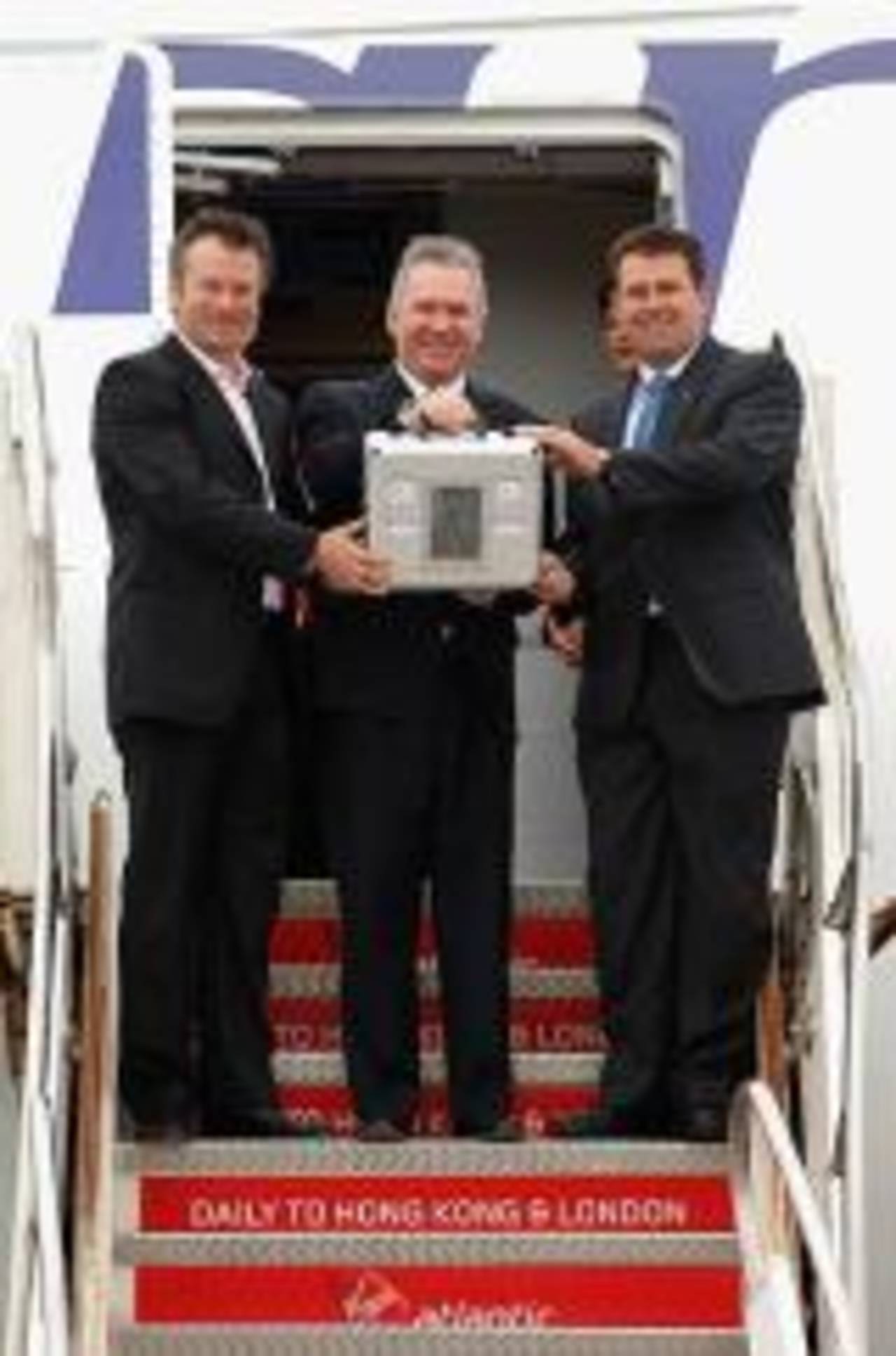 Steve Waugh, Allan Border and Mark Taylor, former Australian captains, pose with the Ashes urn after it arrived in Sydney from England. October 17, 2006