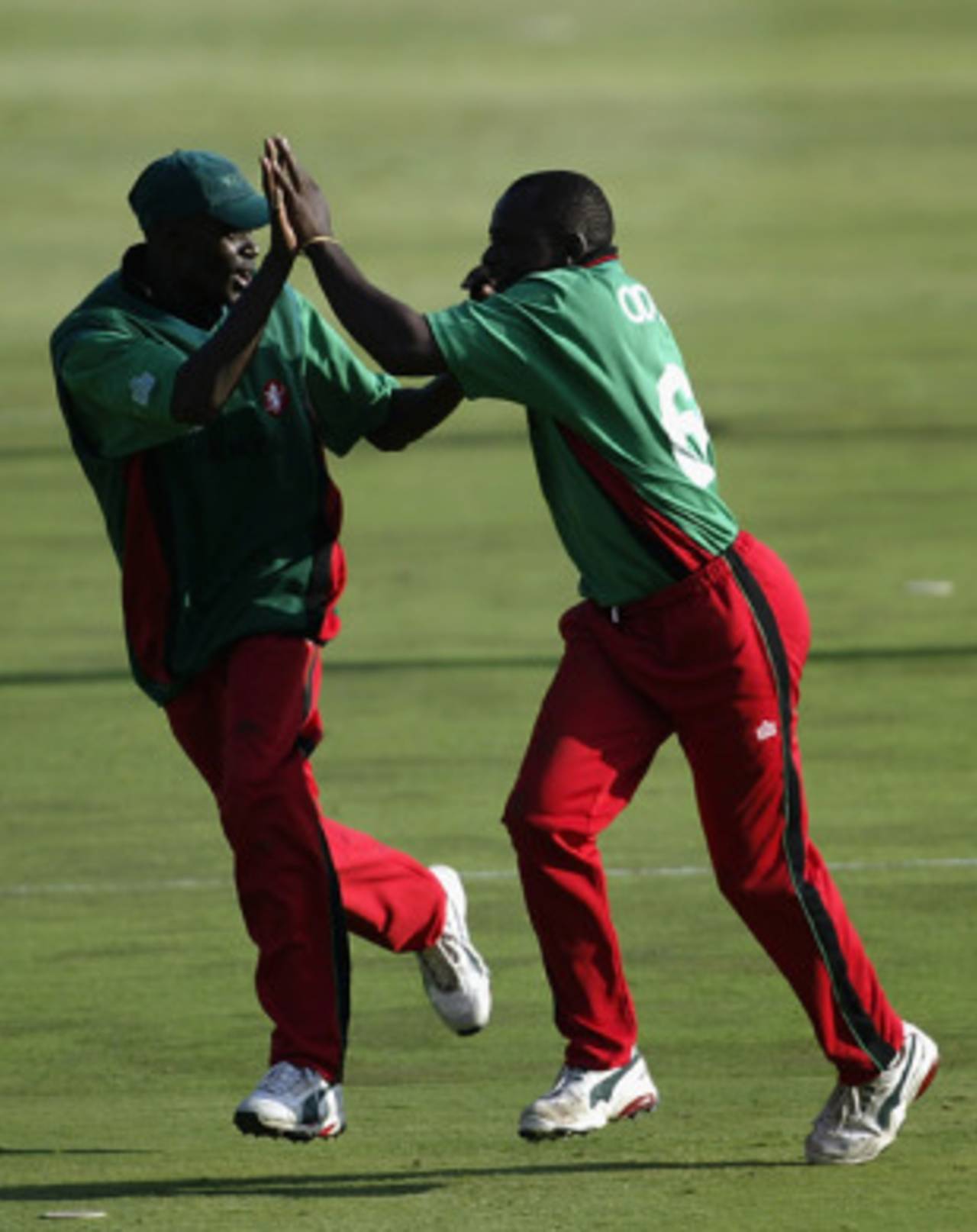 Maurice Odumbe and a team-mate celebrate a wicket during the 2003 World Cup