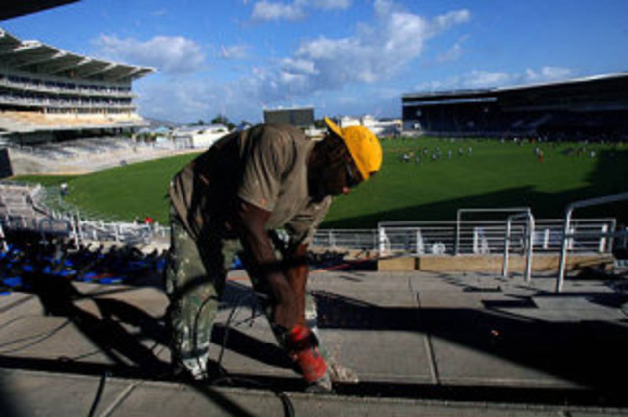 Sparks flying already: a workman prepares the seating at Sabina Park, Kingston, Jamaica, March 4, 2007