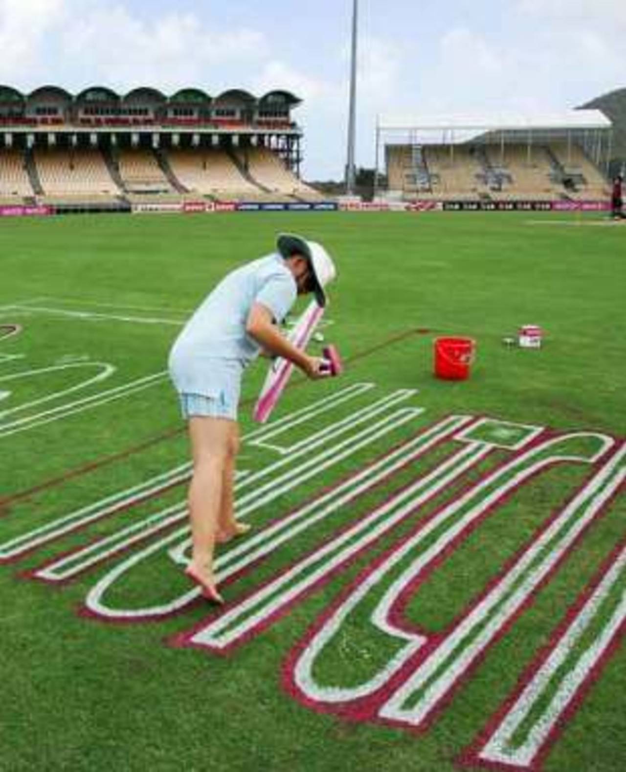 The sponsors are painted onto the outfield as the final touches are put together before the World Cup, 2007 World Cup, St Lucia, March 12, 2007