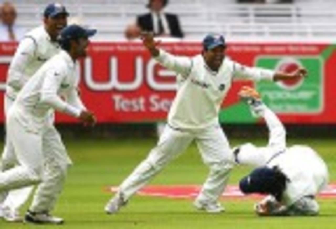 India celebrate as Mahendra Singh Dhoni takes a catch to dismiss Kevin Pietersen. The dismissal was later overturned by the third umpire, England  v India, 1st Test, Lord's, 2nd day, July 20, 2007