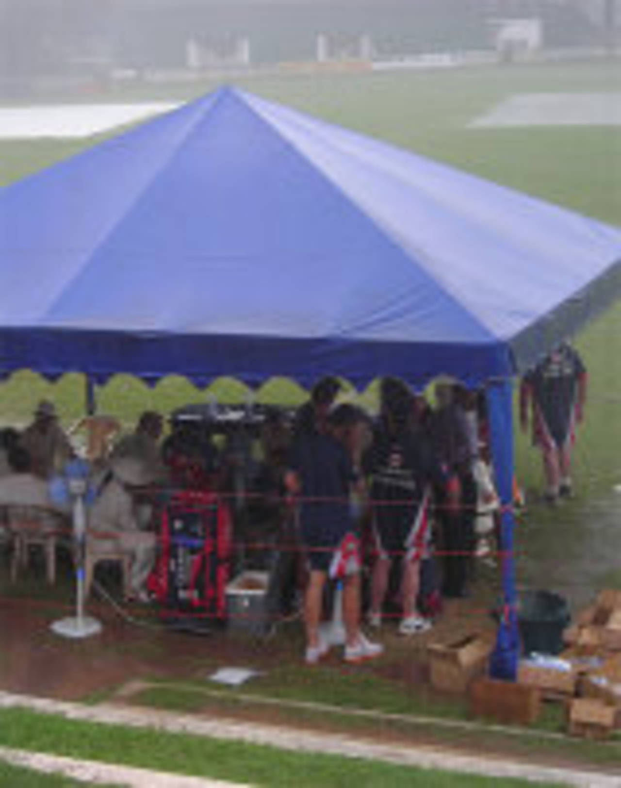 England shelter under a tent as the rain hammers down at Colombo, Sri Lanka Cricket Board President's XI v England XI, Colombo, November 20, 2007