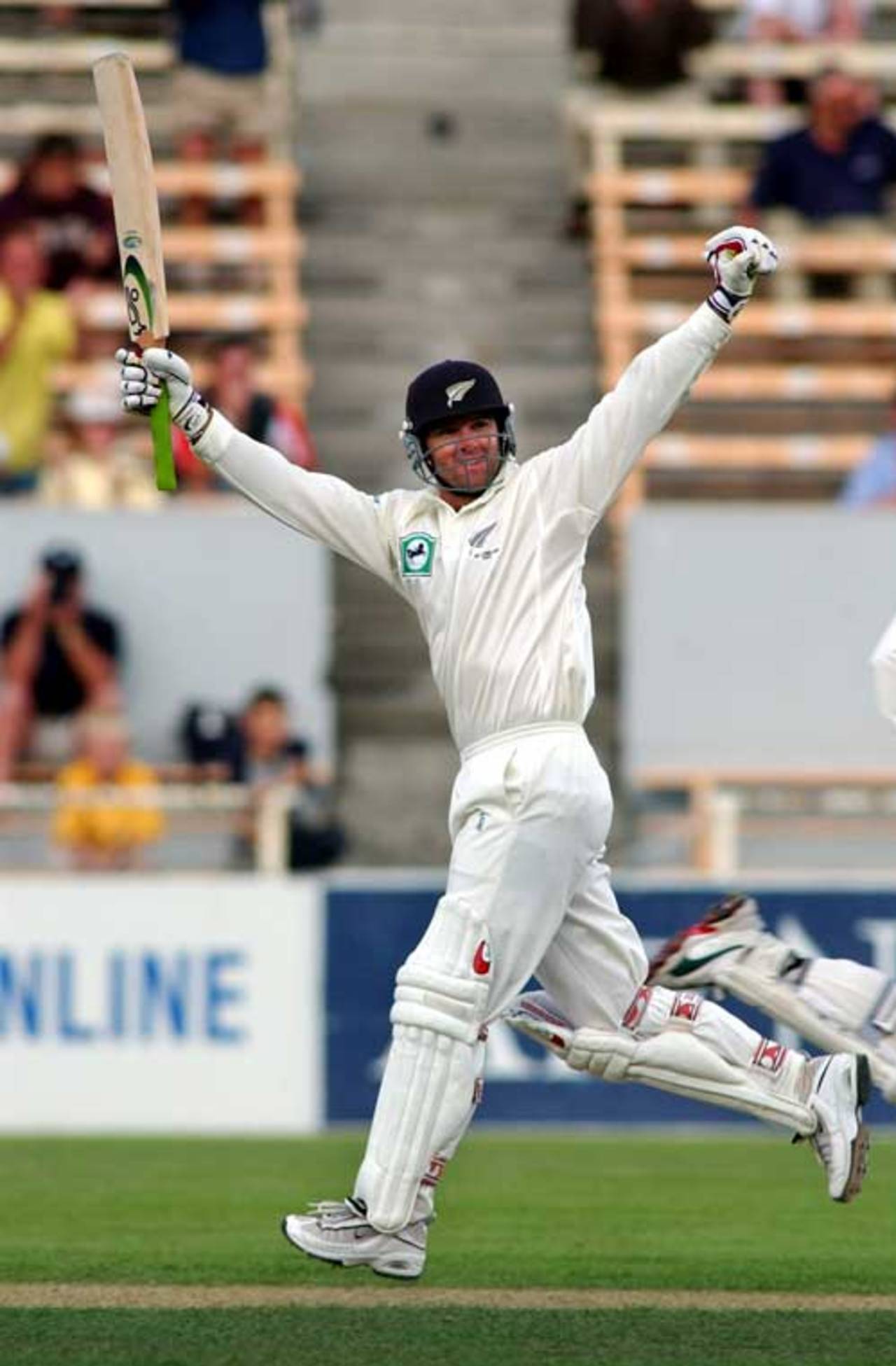 Nathan Astle salutes the crowd on making his double-century, during the third session on day four of the first cricket test between New Zealand and England at Jade Stadium, Christchurch