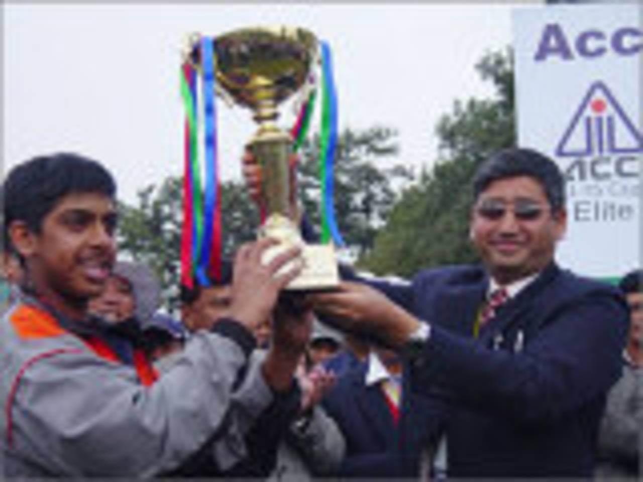 Rezza Gaznavi receives the ACC Under-15 Elite Cup after Singapore defeated Kuwait by six wickets. It was, however, a slightly hollow victory, as eight of the ten competing sides had earlier been disqualified for fielding under-age players, and so Singapore and Kuwait contested the final as they were the only teams remaining in the competition, Bhaktapur, December 3, 2007