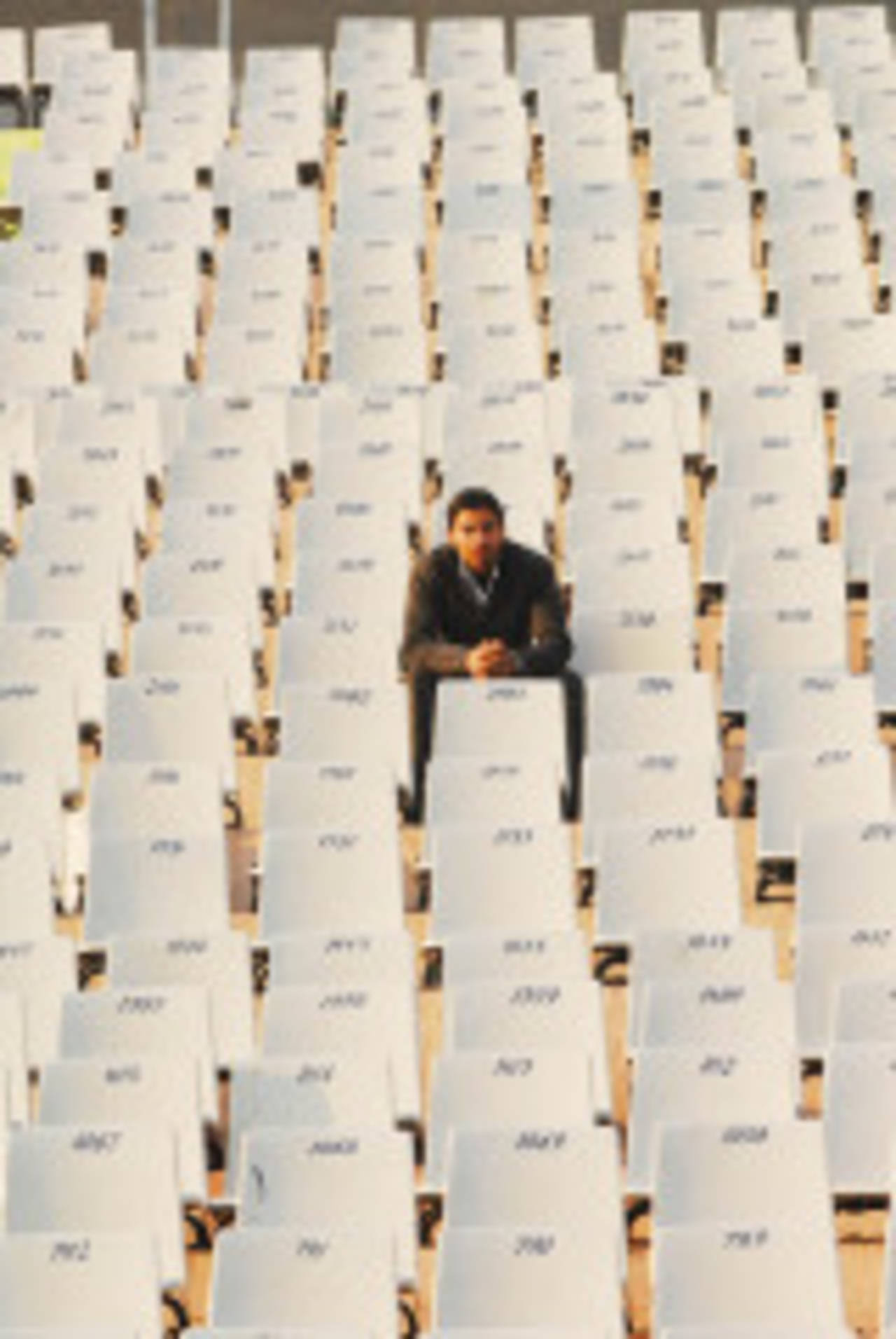 A lone spectator watches the proceedings from a section of the ground at Mohali, Punjab v Orissa, Ranji Trophy Super League, Group A, 6th round, Chandigarh, 3rd day, December 19, 2007 