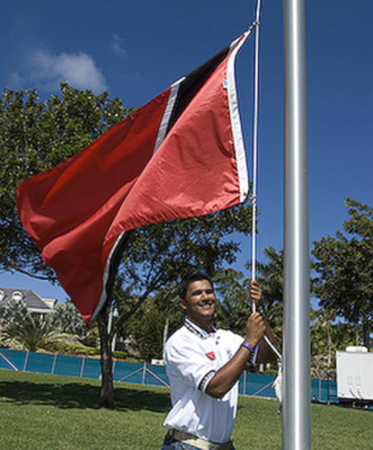 Trinidad's Daren Ganga hoists his country's flag, Antigua, January 25, 2008 