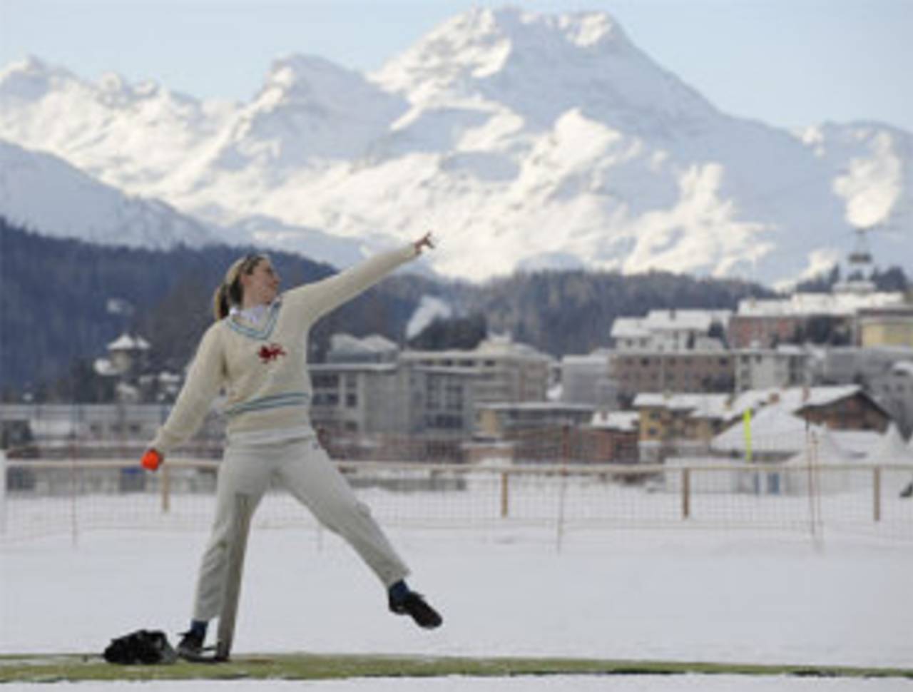 A woman prepares to bowl during 'Cricket on Ice' in Saint Moritz, this began in 1988, when a group of Britons challenged the students of the international boarding school Lyceum Alpinum Zuoz to a game, Switzerland, January 31, 2008