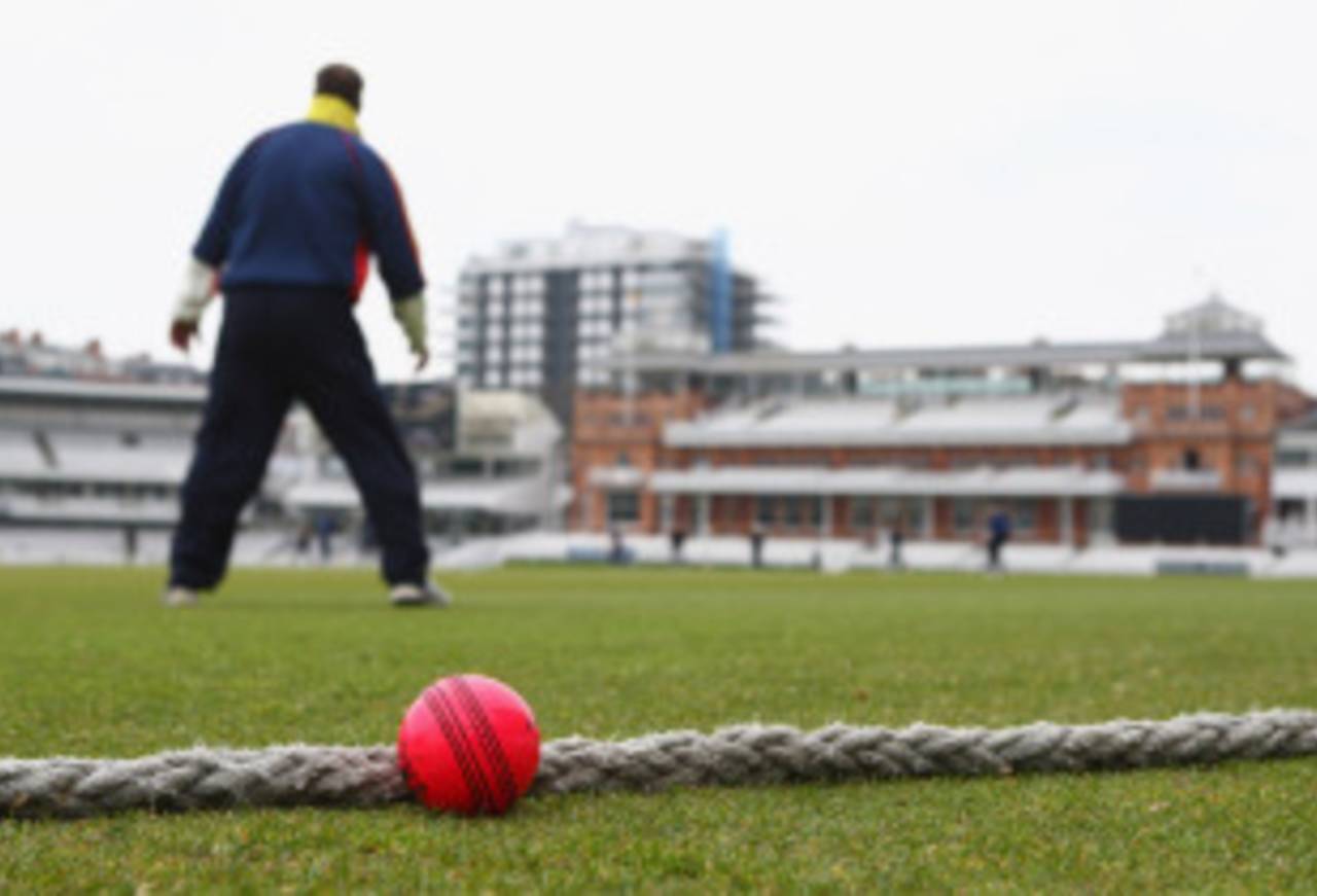 A subtly placed pink ball nestles on the boundary during its trial at Lord's, MCC v Scotland, Lord's, April 21, 2008