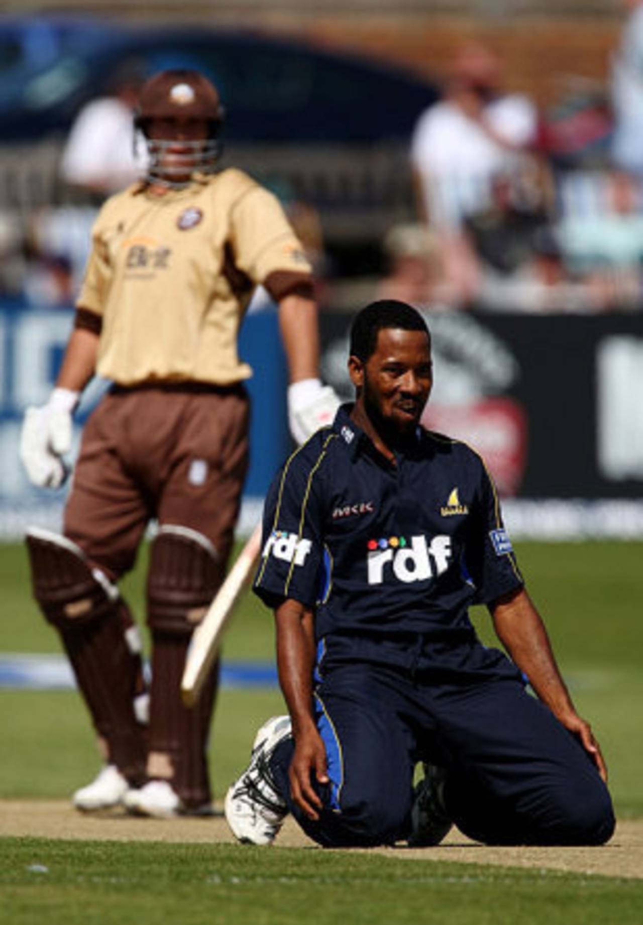 A wry look from Corey Collymore on his debut for Sussex as James Benning belts one back past him, Sussex v Surrey, Friends Provident Trophy, Hove, May 8, 2008