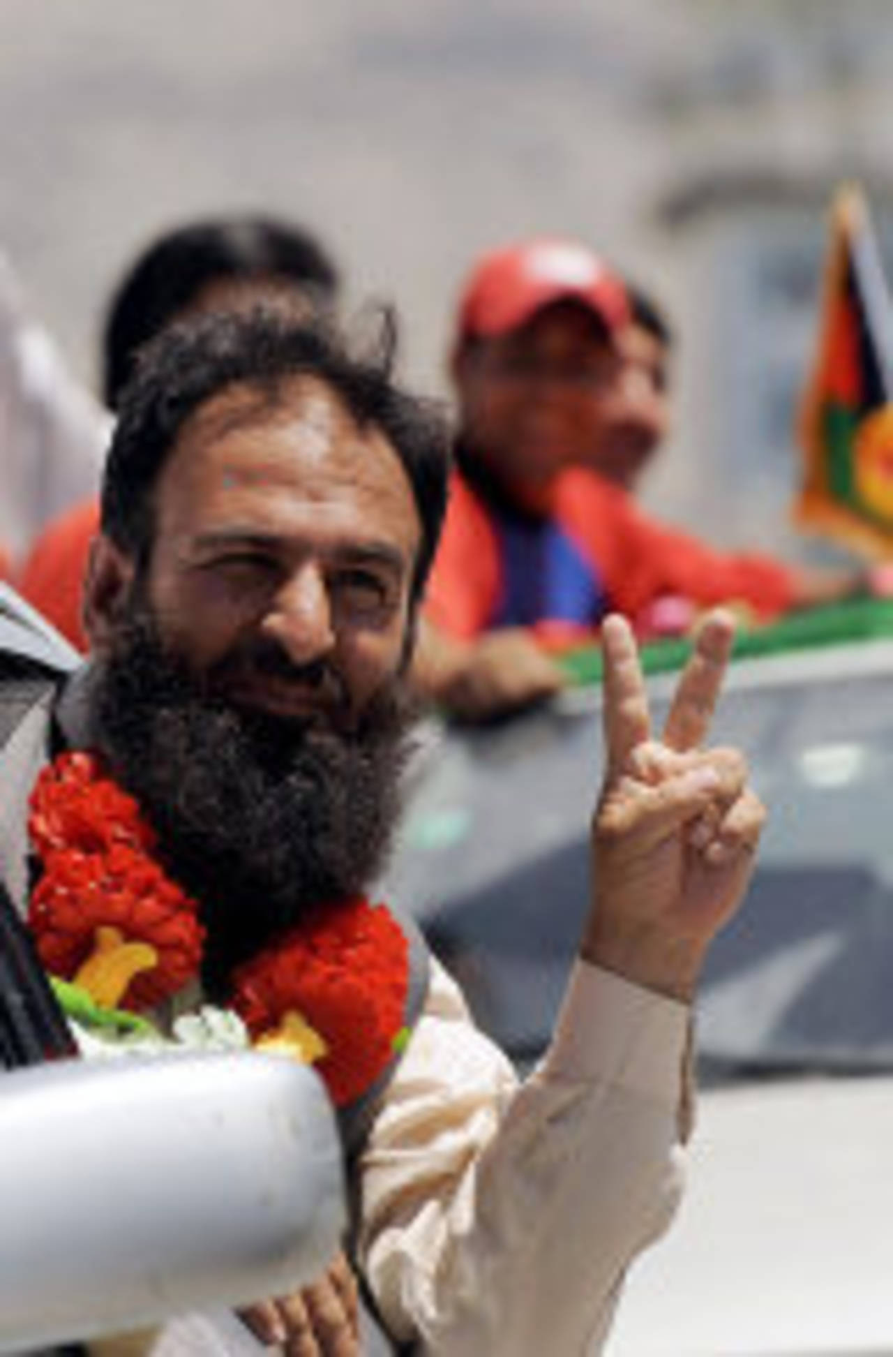 An Afghan man celebrates Afghanistan's triumph in the World Cricket League Division 5, Kabul, June 2, 2008