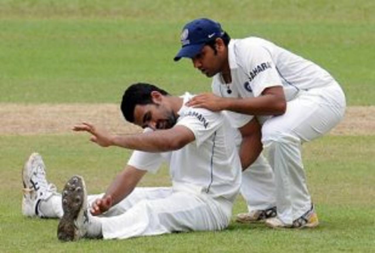 Rohit Sharma helps Zaheer Khan stretch, Sri Lanka Board XI v Indians, tour match, 1st day, July 18, 2008