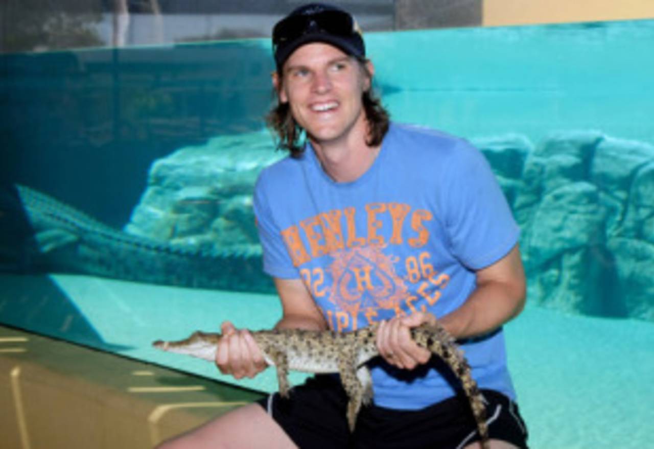 Nathan Bracken holds a crocodile at the Crocosaurus Cove theme park, Darwin, August 31, 2009