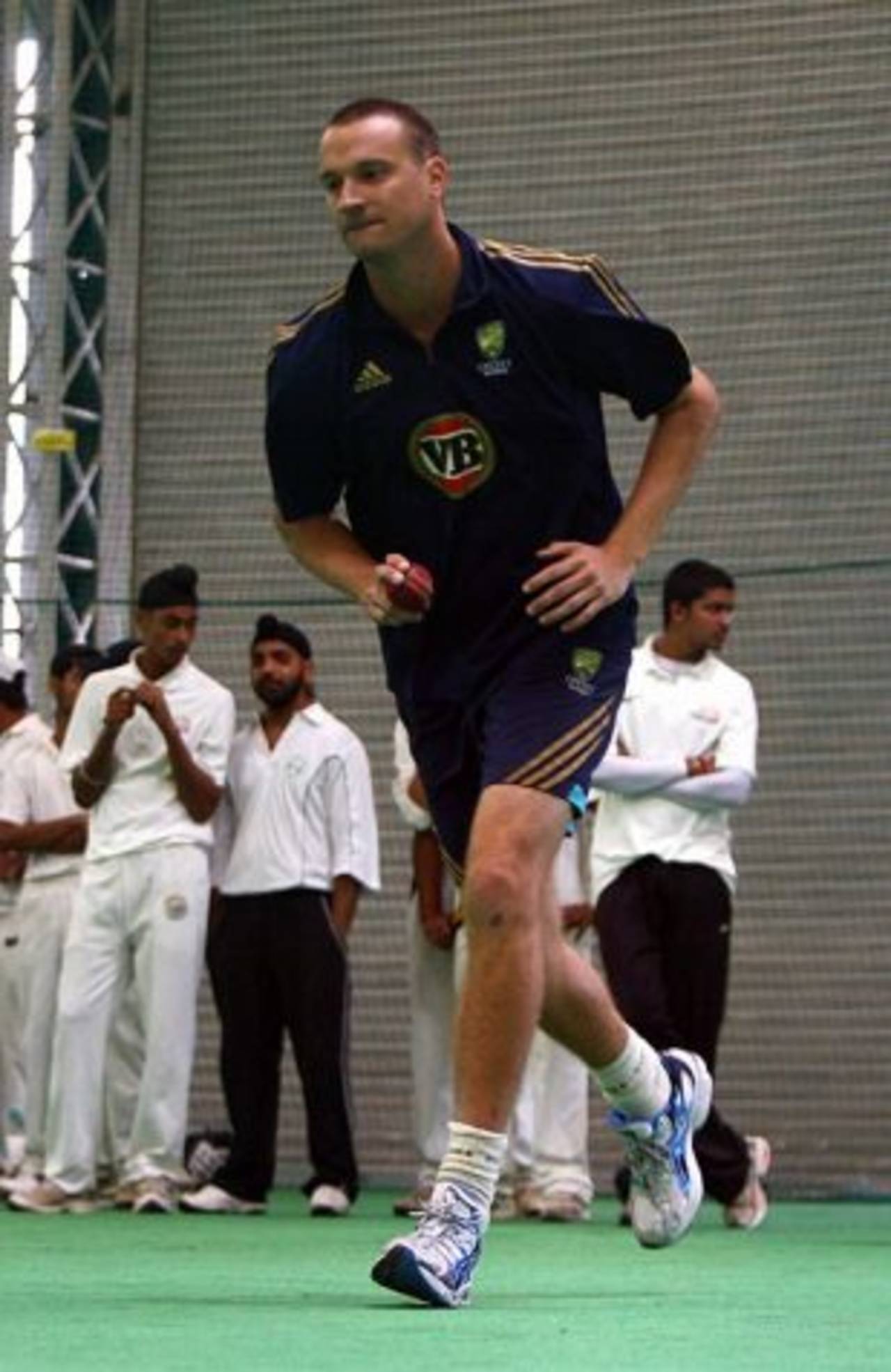 Stuart Clark bowls during an indoor net session, Mohali, October 16, 2008
