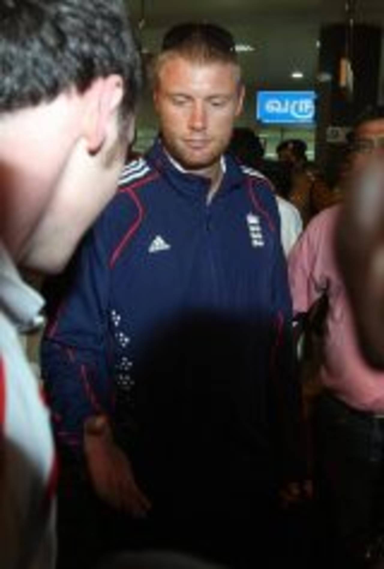 Andrew Flintoff makes his way through the heavy security at the airport, December 8, 2008