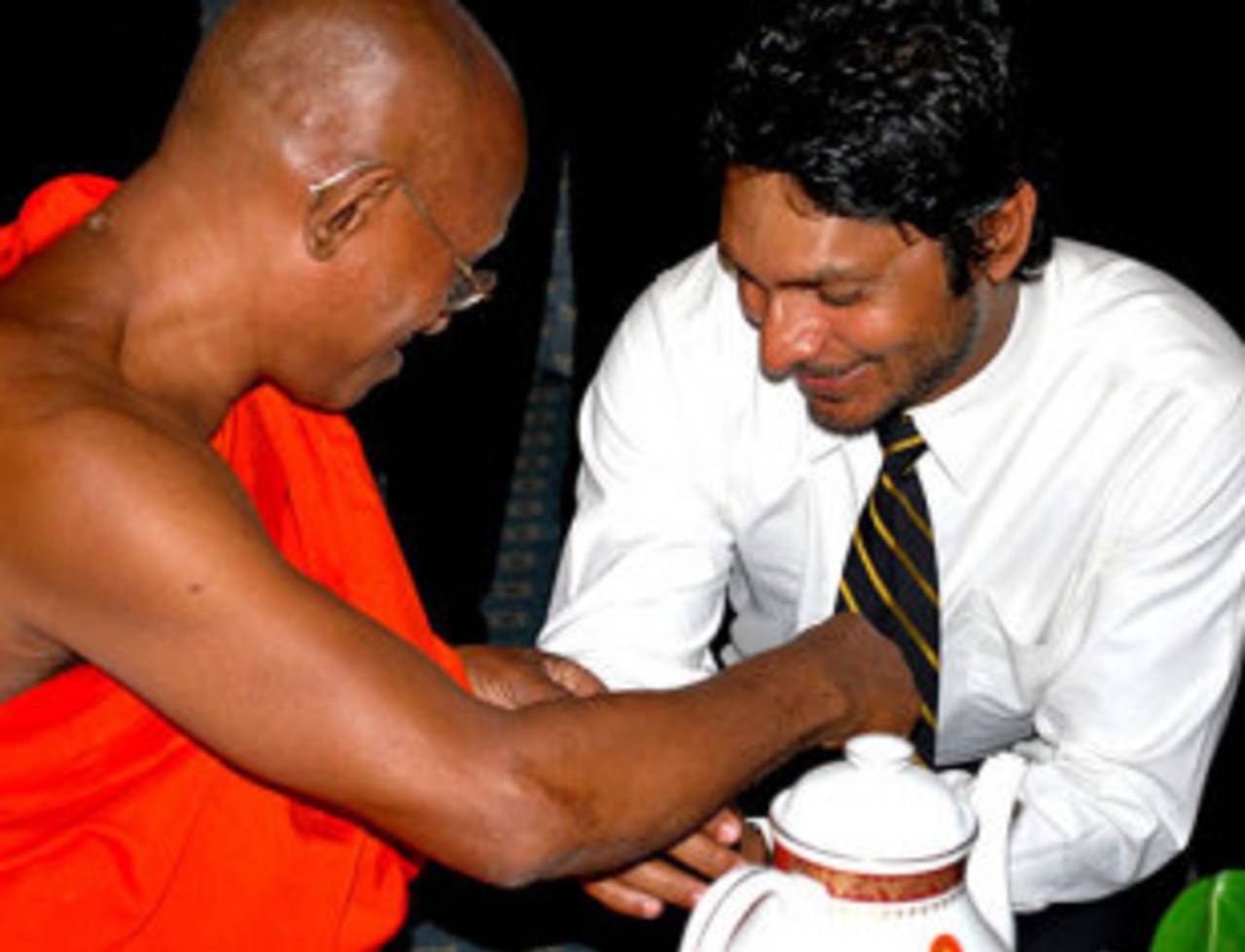 Kumar Sangakkara receives a monk's blessings before the team's departure to Pakistan, Colombo, February 14, 2009