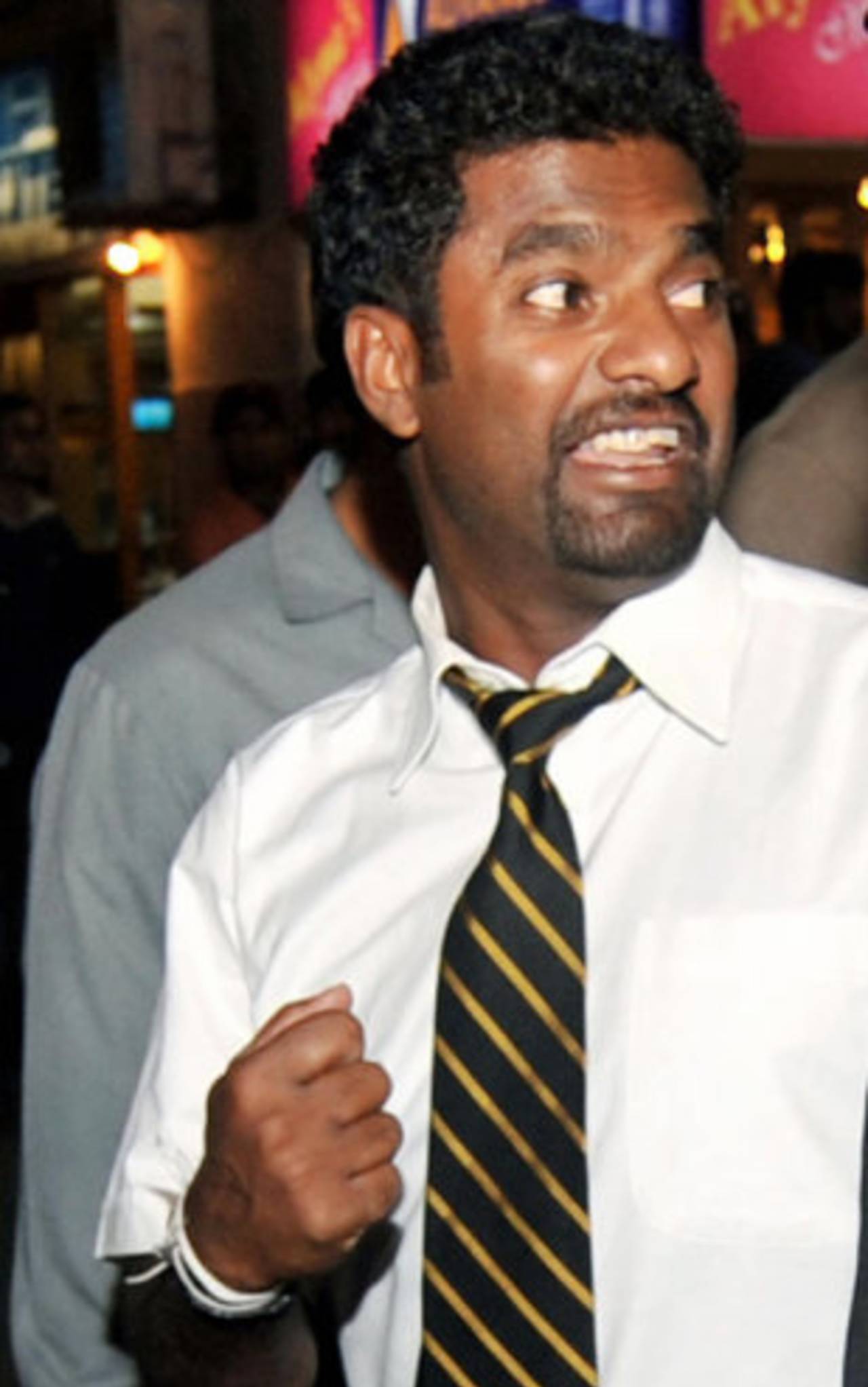 Muttiah Muralitharan walks out of the Karachi airport after the team's arrival for the Test series, Karachi, February 15, 2009