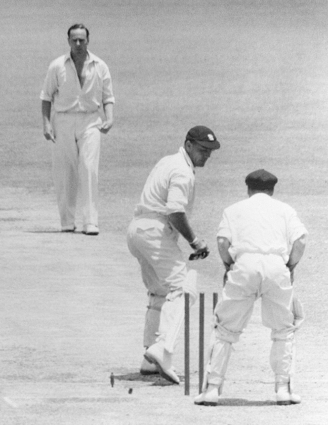 Alec Bedser turns to see that he has been clean bowled by Ian Johnson, Australia v England, 1st Test, Melbourne, November 30, 1954