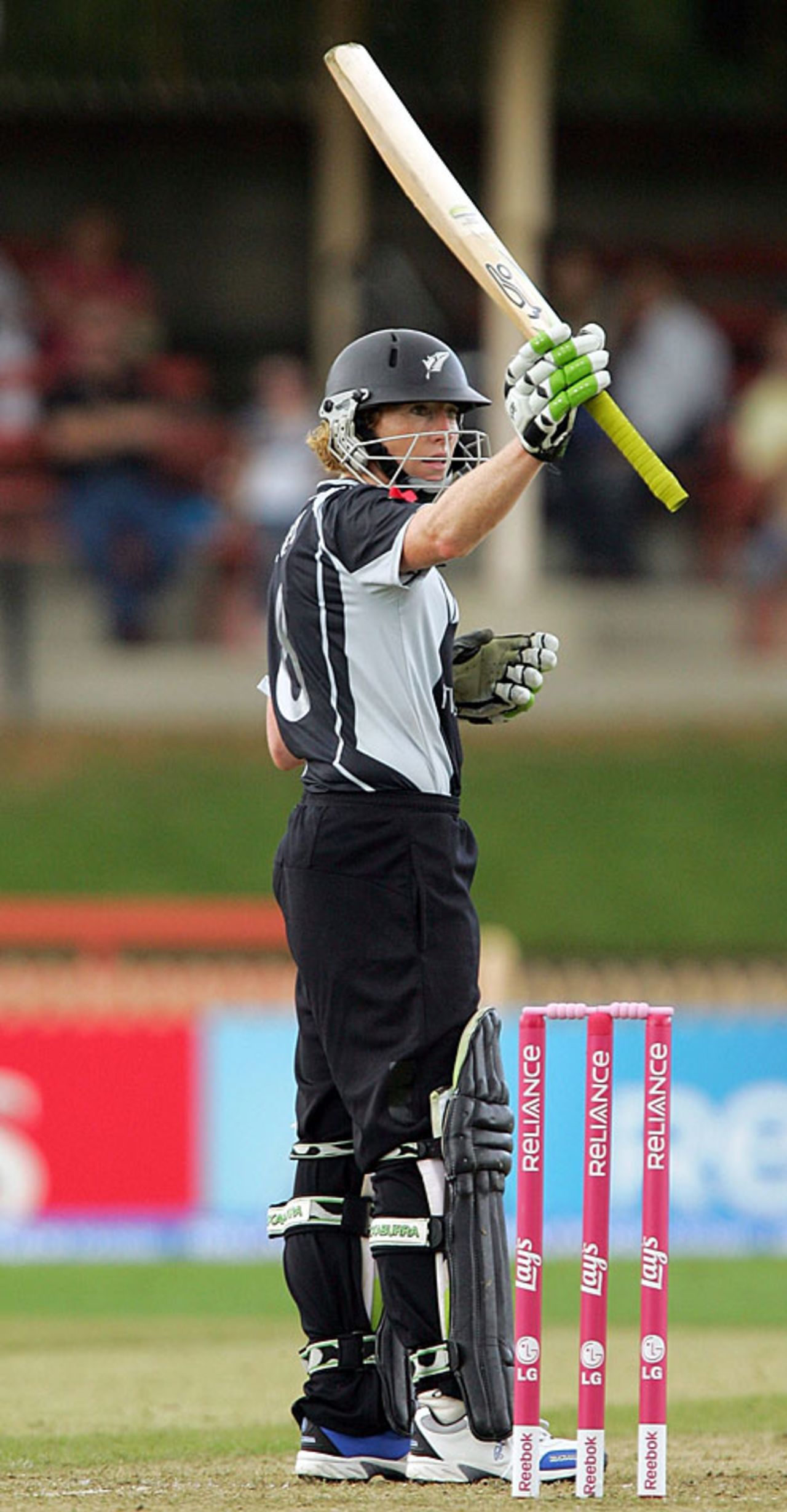 Haidee Tiffen raises the bat after scoring a half-century, Australia v New Zealand, Group A, women's World Cup, North Sydney Oval, March 8, 2009