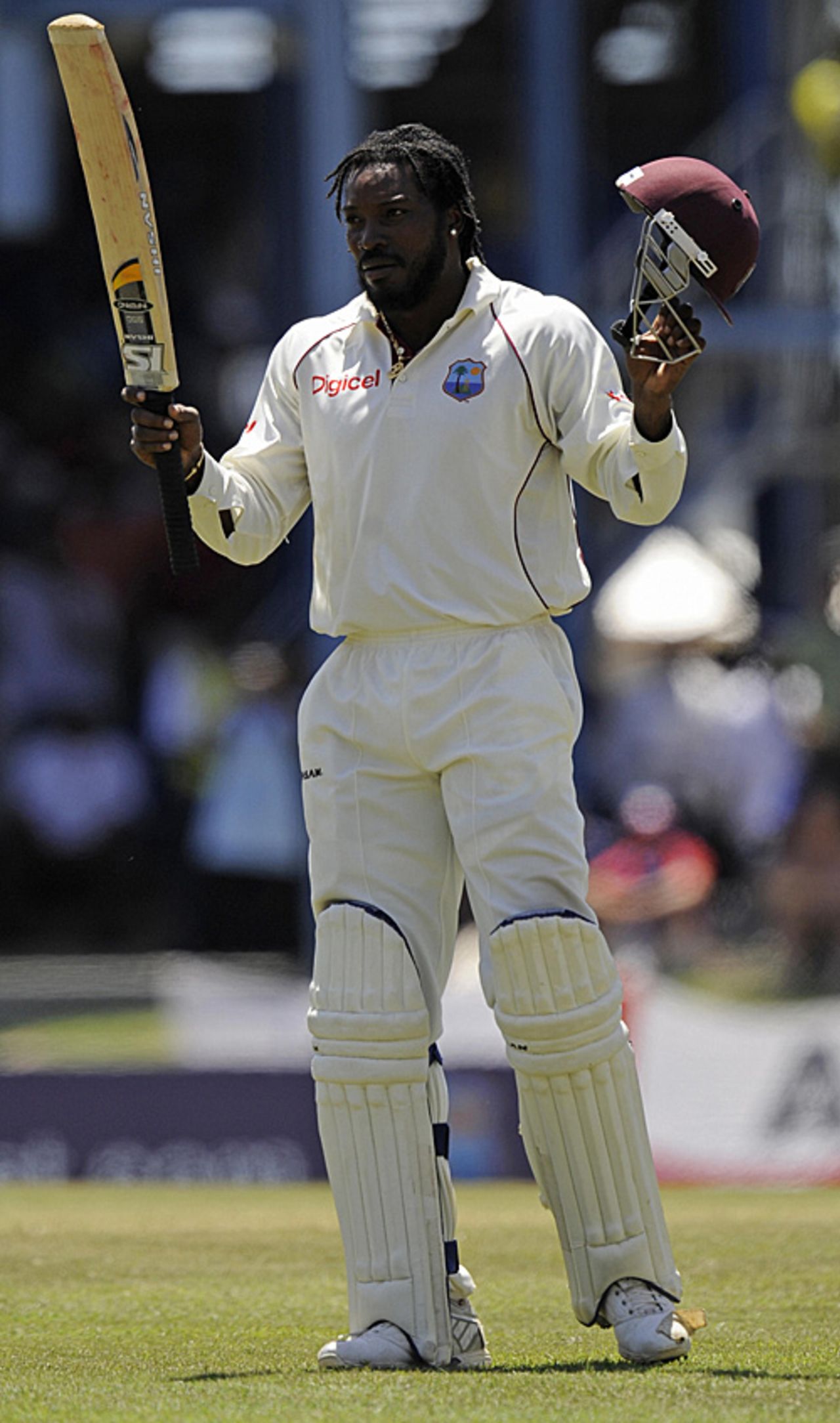 Chris Gayle raises his bat on reaching his hundred but retired hurt immediately afterwards, West Indies v England, 5th Test, Trinidad, March 8, 2009
