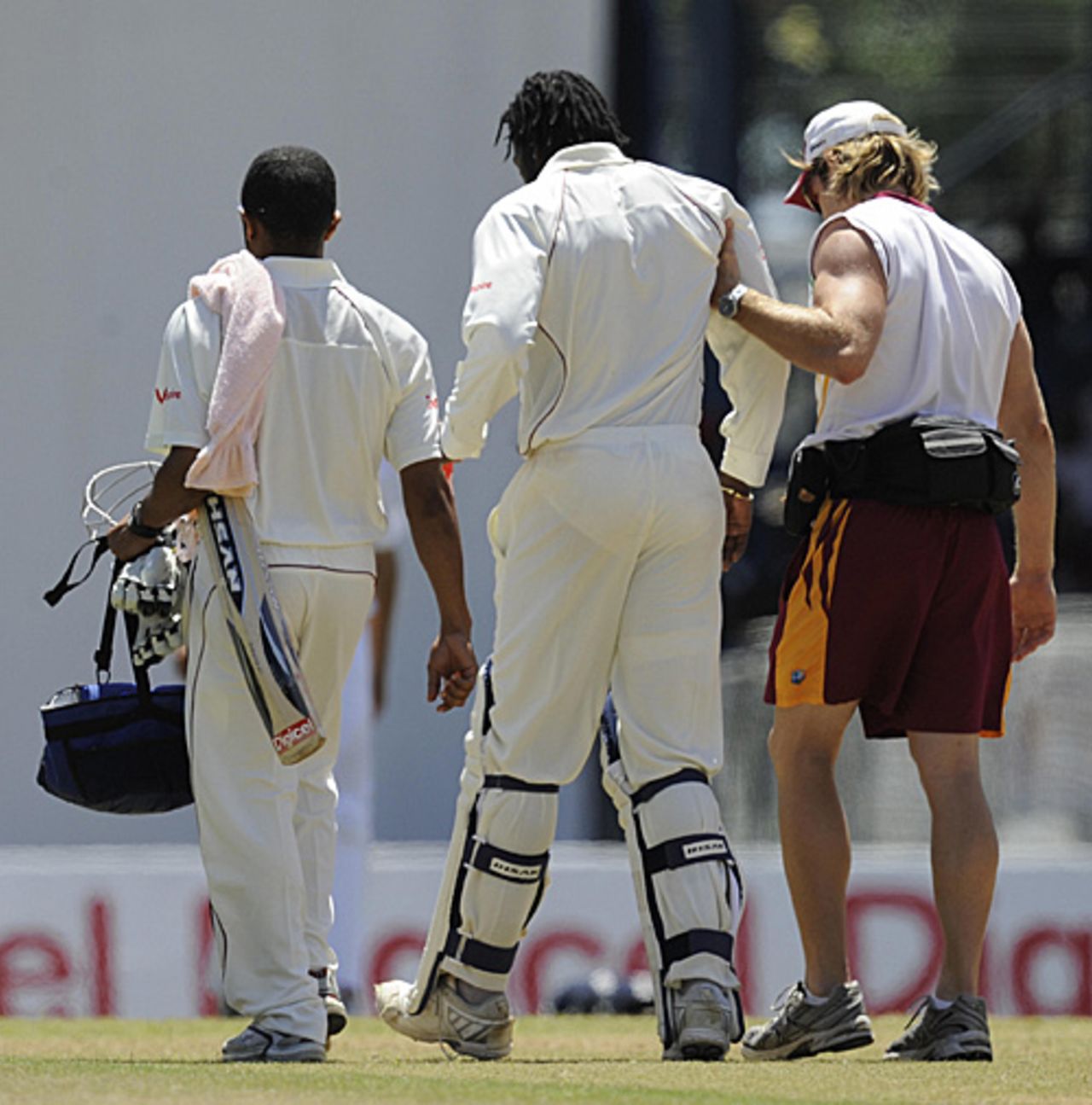 Chris Gayle is helped from the field by the West Indies physio, CJ Clark, West Indies v England, 5th Test, Trinidad, March 8, 2009