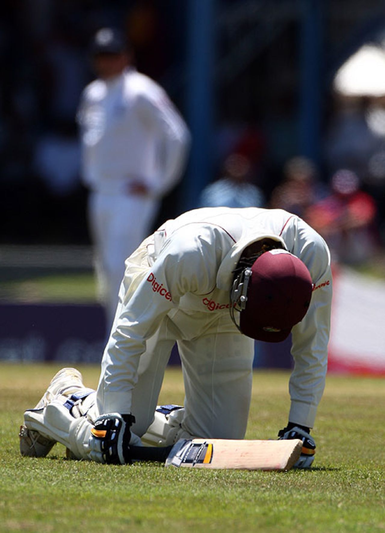 Chris Gayle sinks to his knees after tearing his right hamstring while bringing up his century, West Indies v England, 5th Test, Trinidad, March 8, 2009