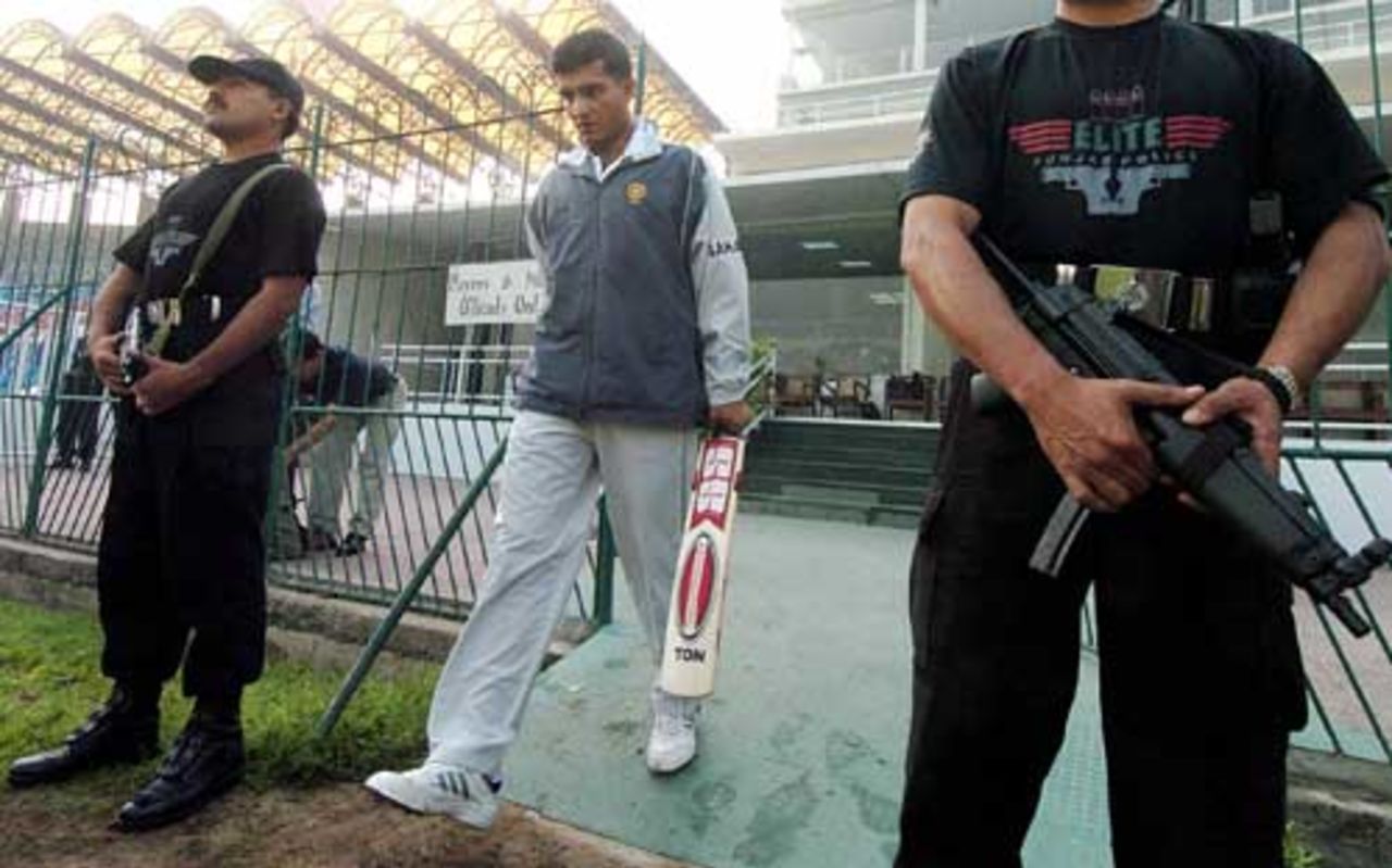 Sourav Ganguly enters the field, flanked by security personnel, Gaddafi Stadium, Lahore, 11 March 2004