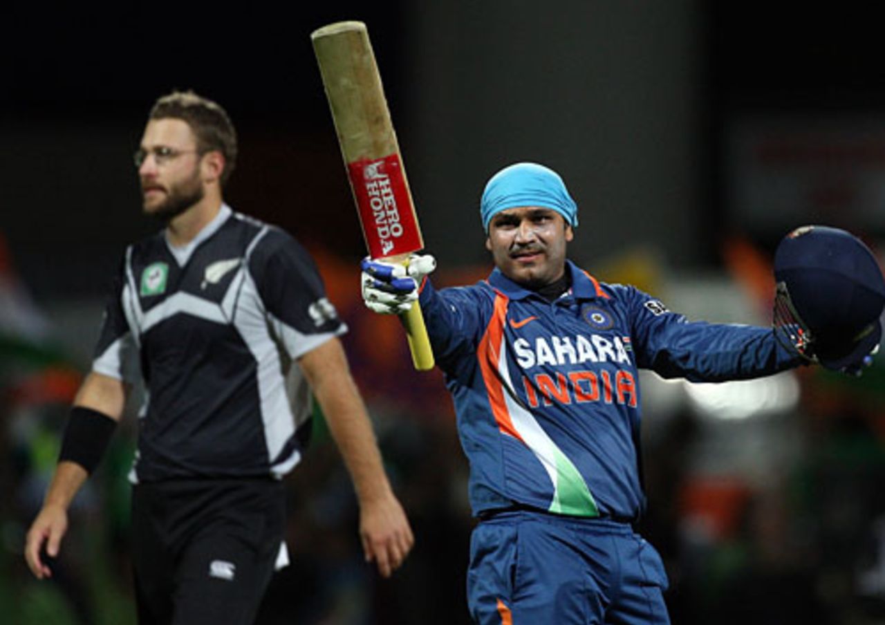 Virender Sehwag raises his bat after reaching his century, New Zealand v India, 4th ODI, Hamilton, March 11, 2009